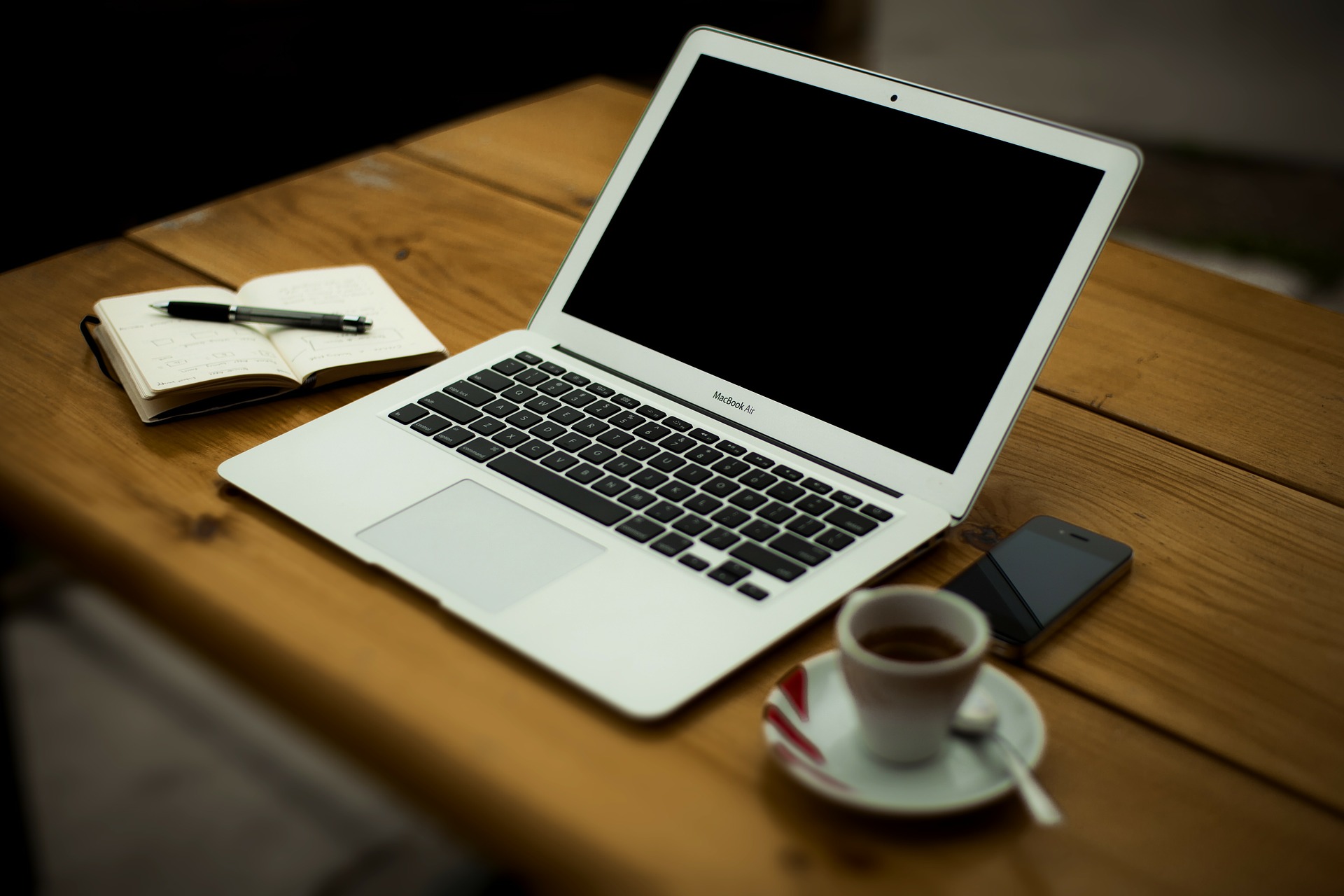 Openlaptopnotebookpenespressophonedesk